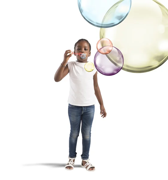 Little girl making soap bubbles — Stock Photo, Image