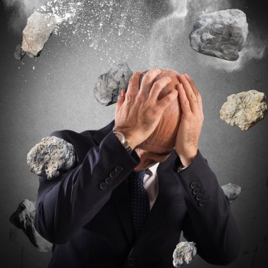 businessman protects from a boulders rain clipart