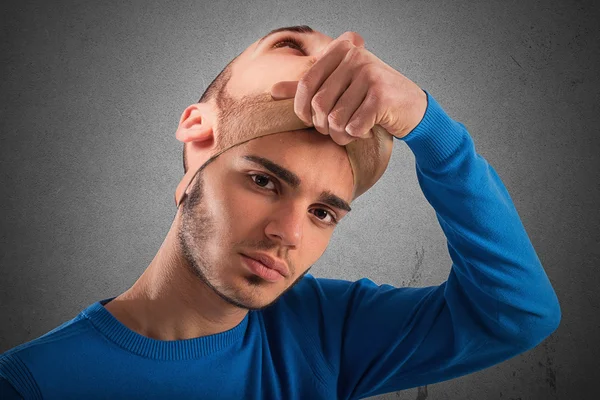 Teenager with adult mask — Stock Photo, Image