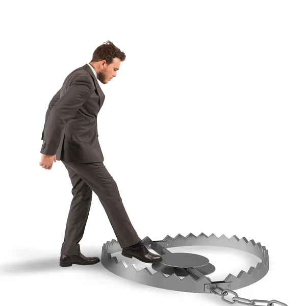 Businessman puts his leg in a trap — Stock Photo, Image