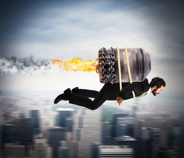 Businessman flying with a turbine — Stock Photo, Image