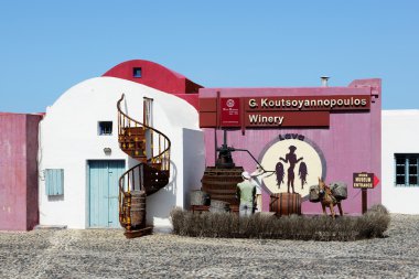 VOTHONAS, THIRA, GREECE - MAY 19:  The decoration of  Koutsoyannopoulos Wine Museum on May 19, 2014 in Vothonas, Thira, Greece. It is occupies a natural cave and has a labyrinth-like shape. clipart