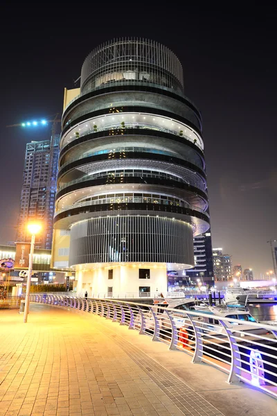 DUBAI, UAE - SEPTEMBER 11: The night illumination of Dubai Marina on September 11, 2013 in Dubai, UAE. It is an artificial canal city, built along a two mile (3 km) stretch of Persian Gulf shoreline.