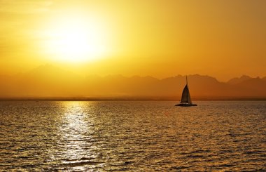 Sunset and yacht on Red Sea, Hurghada, Egypt clipart