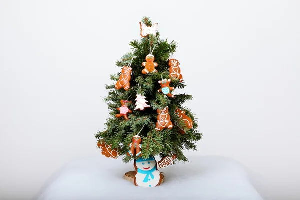 The New Year tree and hand-made cookies with snow decoration — Stock Photo, Image