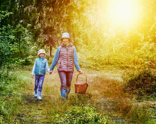 Mother and daughter walking in the woods. — Stock Photo, Image