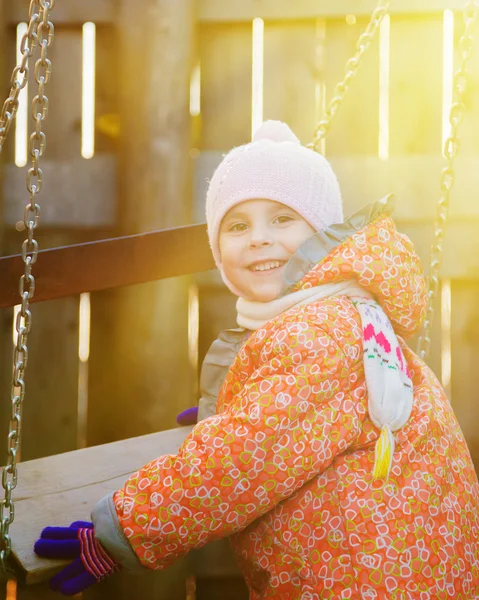 Cute kid swinging. — Stock Photo, Image