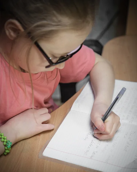 Girl make written lessons. — Stock Photo, Image