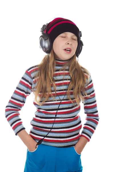 Lány fülhallgatóval zenét hallgat. — Stock Fotó