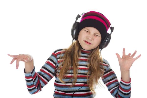 Lány fülhallgatóval zenét hallgat. — Stock Fotó