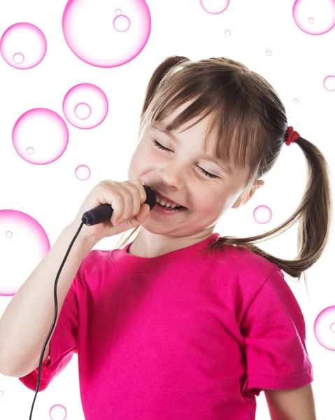 Zpívá malá holčička. — Stock fotografie