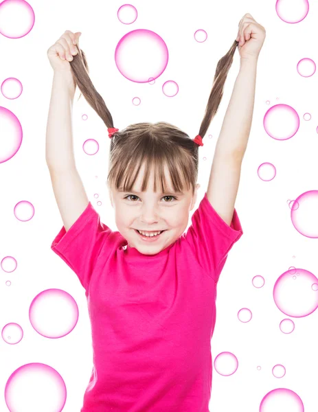 Happy little girl with pigtails. — Stock Photo, Image