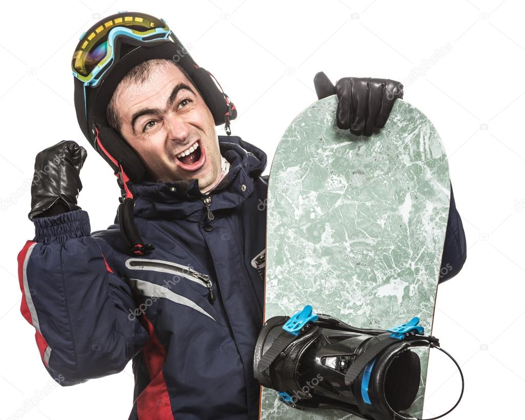 Male snowboarder with the board.