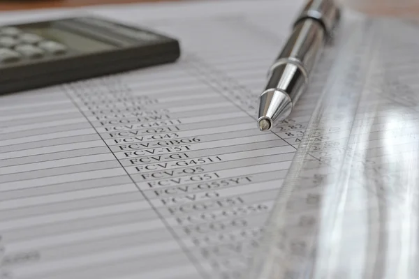 Business background with table, ruler, pen and calculator — Stock Photo, Image