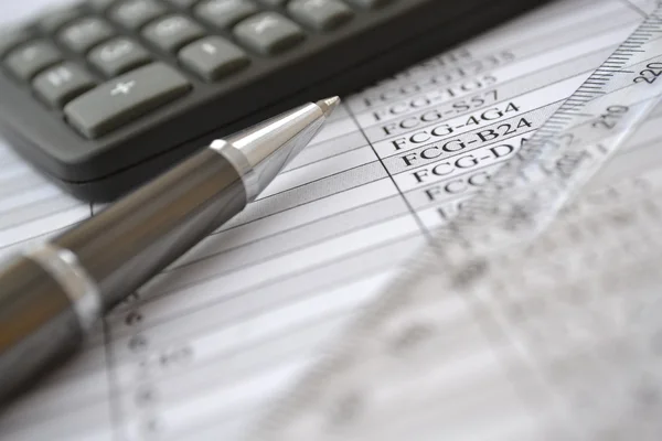 Business background with table, ruler, pen and calculator — Stock Photo, Image