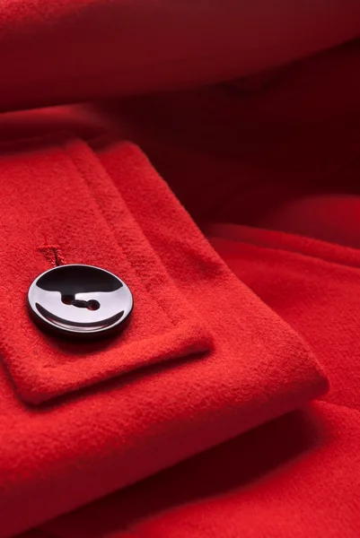 Botão no casaco vermelho — Fotografia de Stock