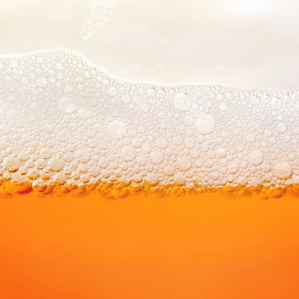 Beer froth in glass — Stock Photo, Image