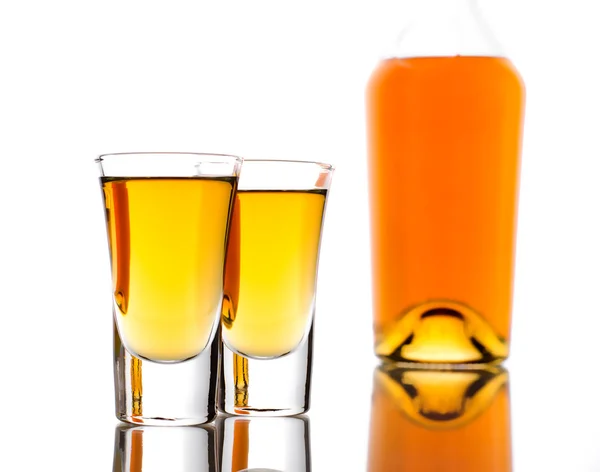 Two shots of whisky and bottle — Stock Photo, Image