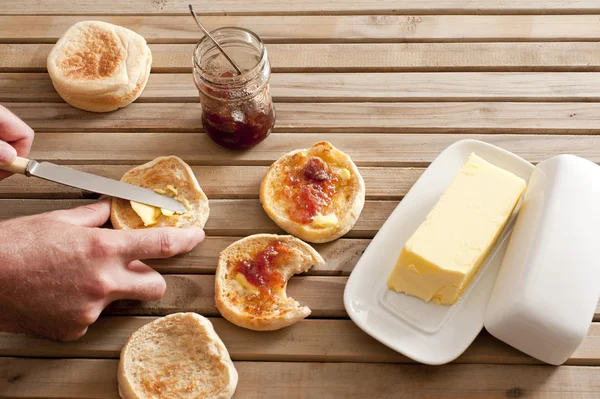 English muffins with butter and jelly spread — Stock Photo, Image