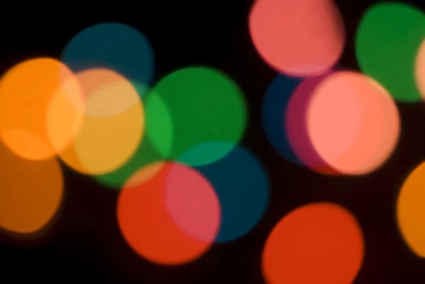 Bokeh de luces de fiesta de colores — Foto de Stock