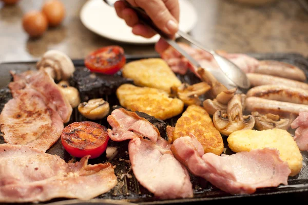 Man serving a hearty cooked breakfast — Stock Photo, Image