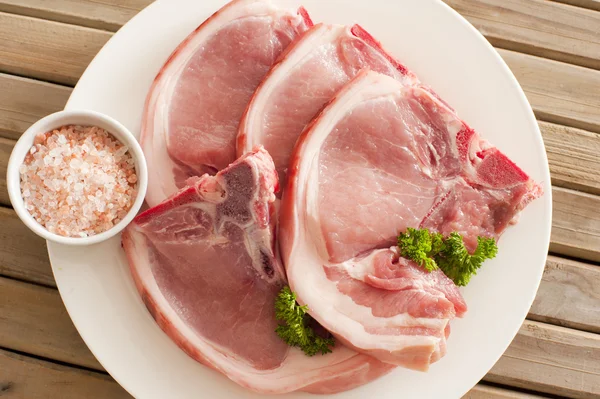 Raw pork cutlets with their rind — Stock Photo, Image