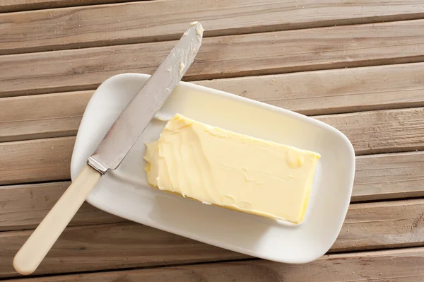Pat zemědělských čerstvého másla na jídlo — Stock fotografie