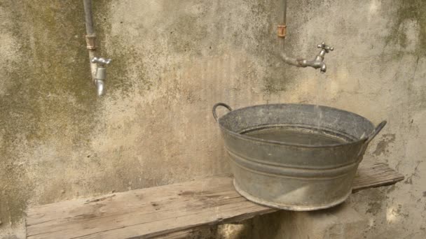 Water Pouring out of a Tap into a Basin — Stock Video