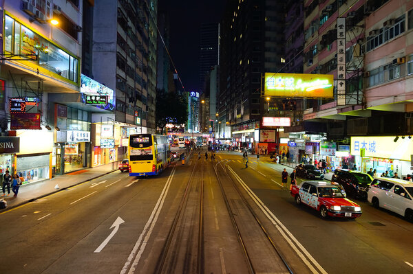 HONG KONG - DECEMBER 25, 2015: view from upper deck of double-decker tramway. The tram is the cheapest mode of public transport on Hong Kong island