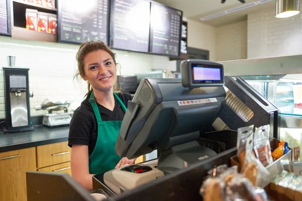 Worker at Starbucks Cafe — Stock Photo, Image