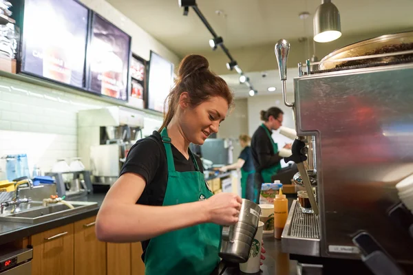 Worker at Starbucks Cafe — Stock Photo, Image