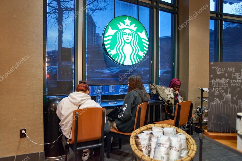 NEW YORK, USA - CIRCA MARCH 2016: inside of Starbucks Cafe. Starbucks Corporation is an American global coffee company and coffeehouse chain based in Seattle, Washington