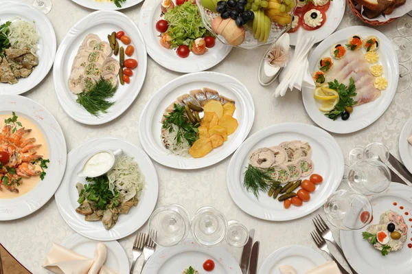 Table with food in restaurant — Stock Photo, Image