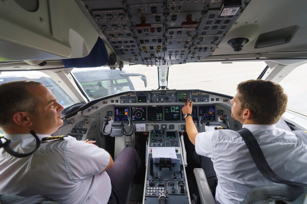 Pilots in aircraft cockpit