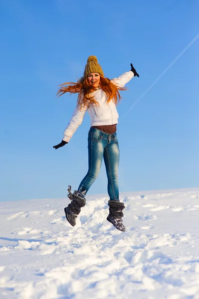 Woman on the snow field — Stock Photo, Image