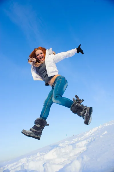 Woman on the snow field — Stock Photo, Image