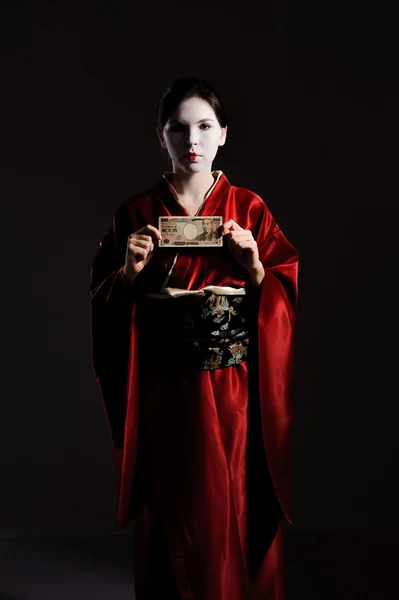 Flickan i native kostym av japanska geisha — Stockfoto