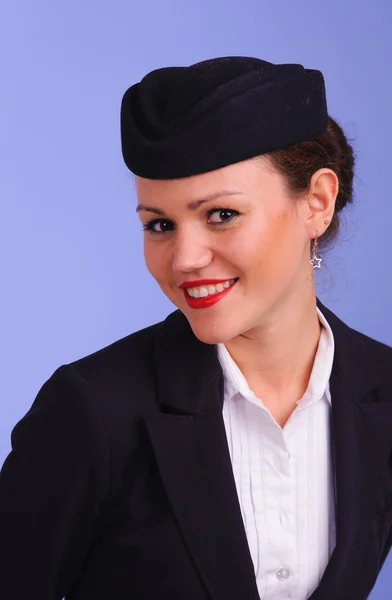 Stewardesa w czarne ubrania — Zdjęcie stockowe