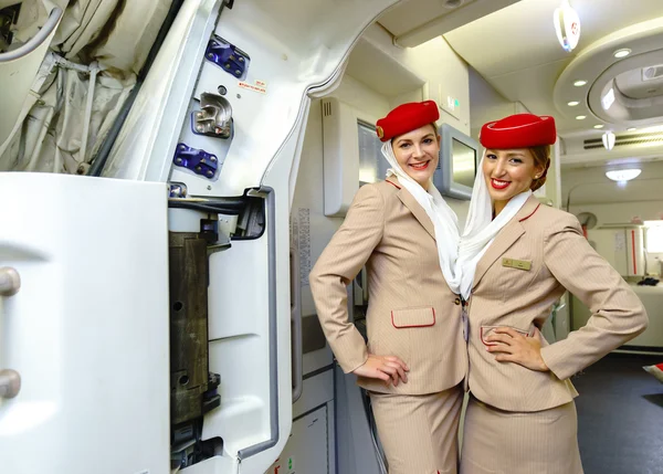 Emirates crew members meet passengers