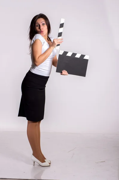 Woman with clapboard on backgound — Stock Photo, Image