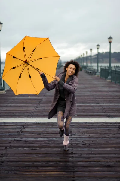 Young african woman with umbrella — Stock Photo, Image