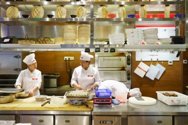 cook chiefs working in restaurant