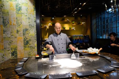 cooking master in asian restaurant.