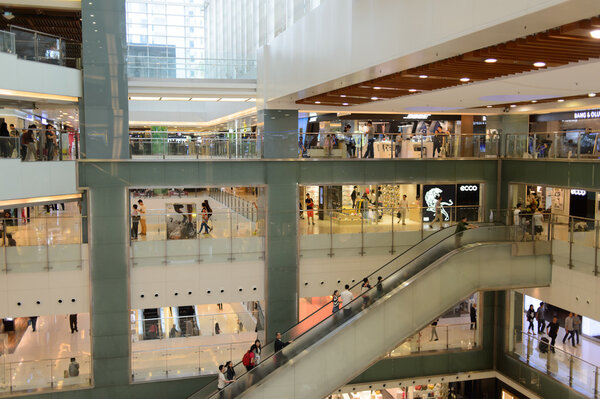 HONG KONG - APRIL 03, 2015: New Town Plaza interior with customers . New Town Plaza is a shopping mall in the town center of Sha Tin in Hong Kong. Developed by Sun Hung Kai Properties.
