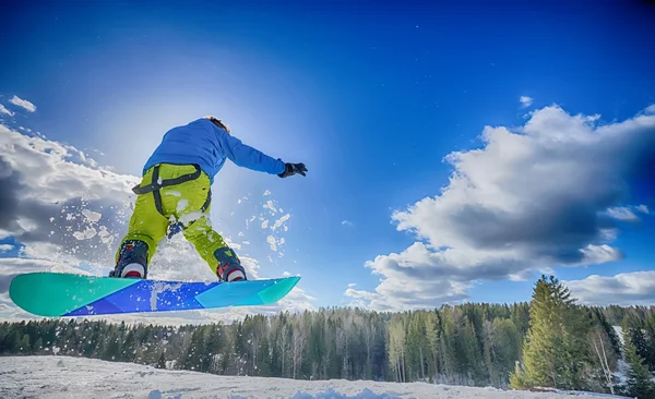 Young man on the snowboard — Stock Photo, Image