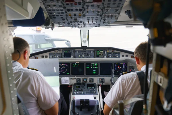 Etihad Regional pilots in cockpit — Stok fotoğraf