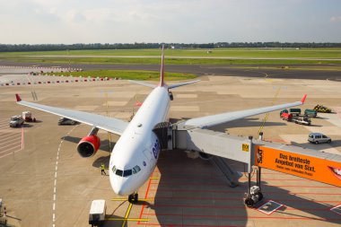 docked plane on airfield
