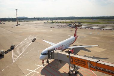 docked plane on airfield
