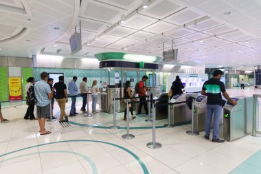 people in Dubai subway interior