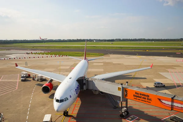 docked plane on airfield